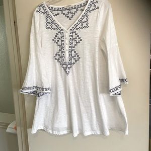 Tunic size large, white with blue stitching.
